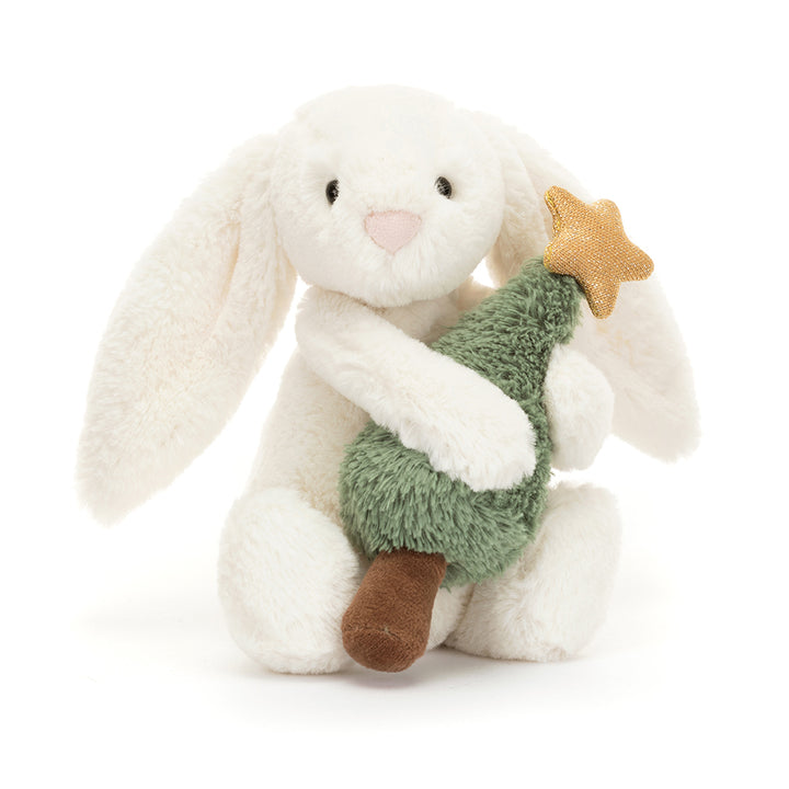 Soft white plush bunny hugging a green Christmas tree with a gold star, Bashful Bunny with Christmas Tree