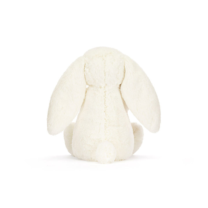 Back view Jellycat Cream Bunny plush with soft cream fur and floppy ears on a white background