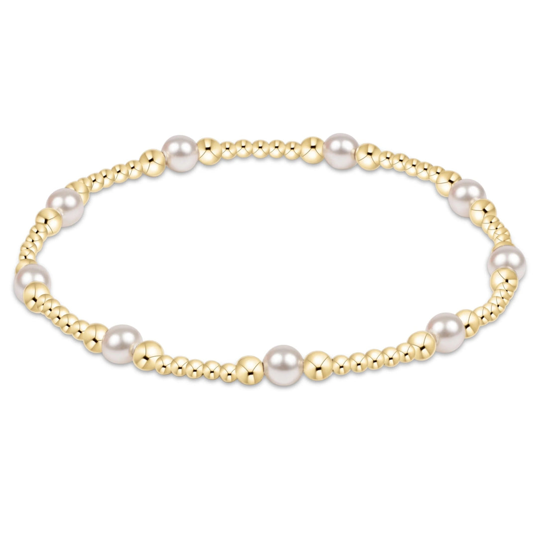 eNewton Purpose Pearl 4mm Gold Bracelet with white crystal pearls and 14kt gold-filled beads in a delicate patterned design