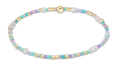Lilac, aqua, and gold beaded bracelet with 14kt gold accents on elastic band