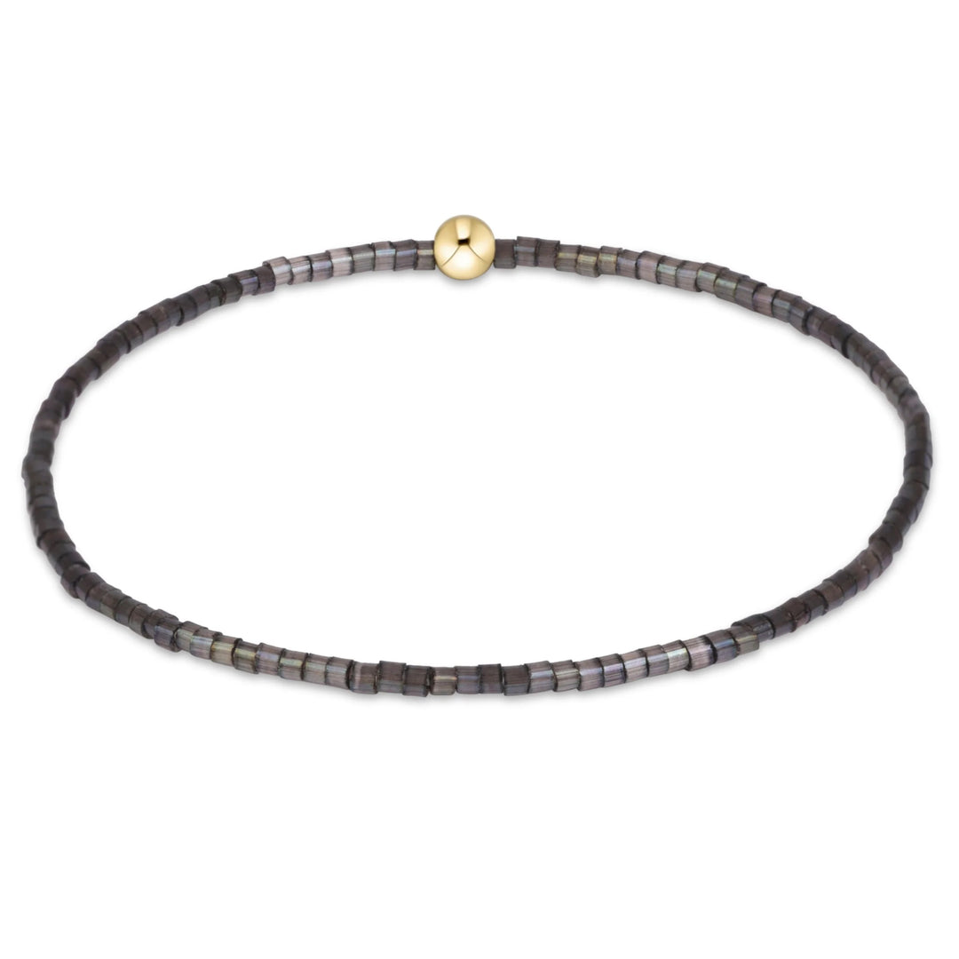 eNewton Hope Classic Bracelet in Moonlight featuring smoky charcoal and iridescent gray seed beads with a single 14kt gold-filled accent bead