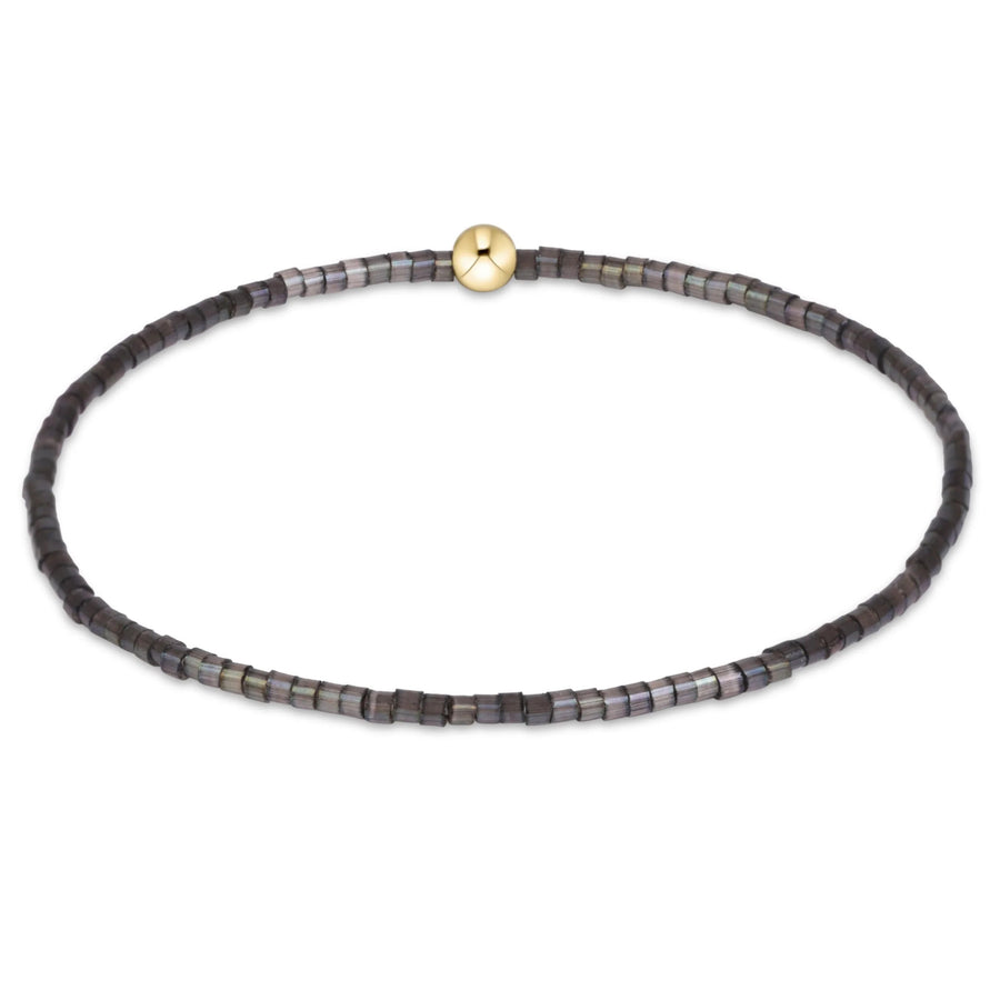 eNewton Hope Classic Bracelet in Moonlight featuring smoky charcoal and iridescent gray seed beads with a single 14kt gold-filled accent bead