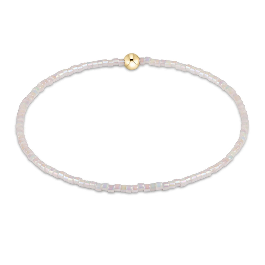 silky white beaded hope classic bracelet with gold accent bead by enewton