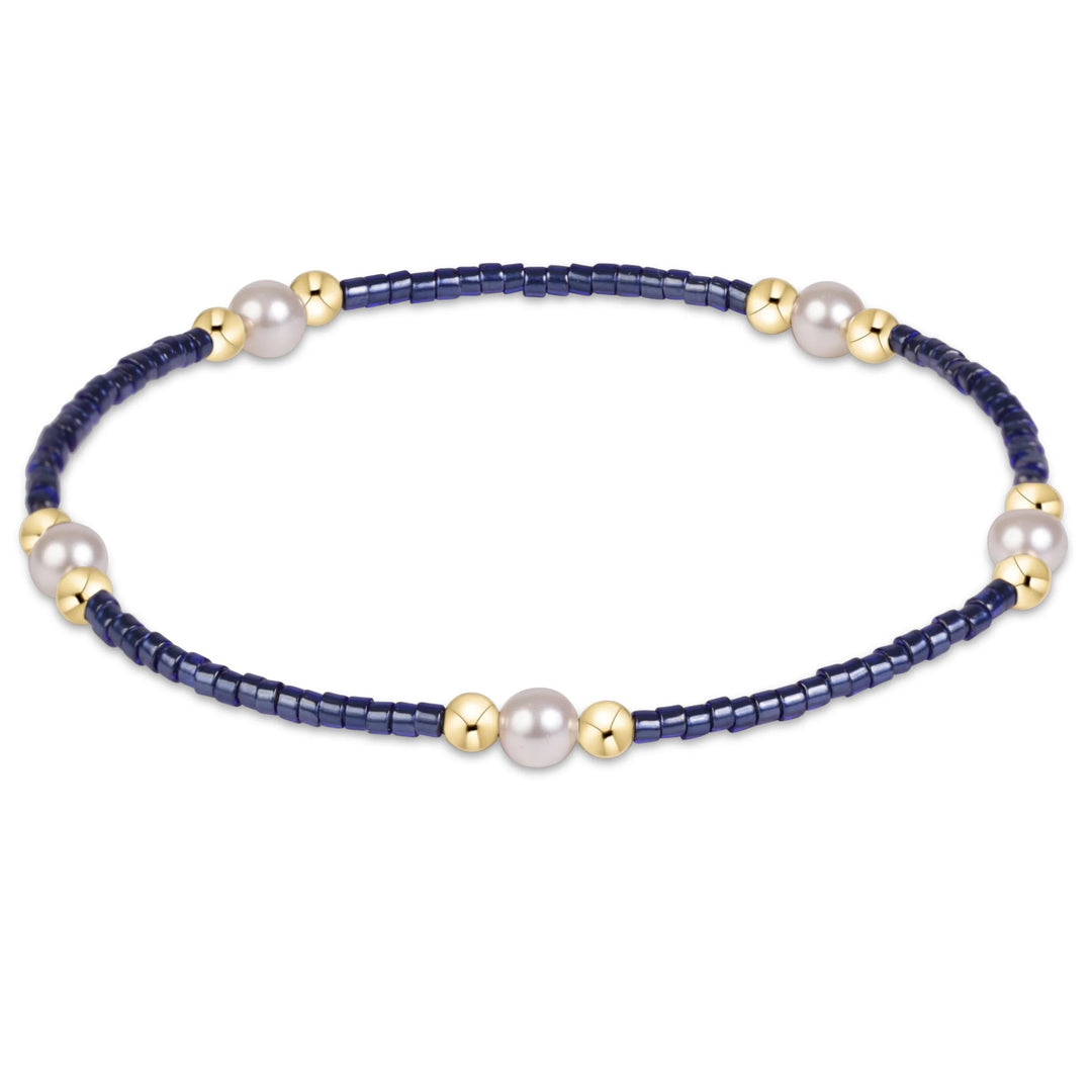 eNewton Hope Purpose Pearl Bracelet in Navy with deep blue seed beads, white crystal pearls, and polished 14kt gold-filled accent beads