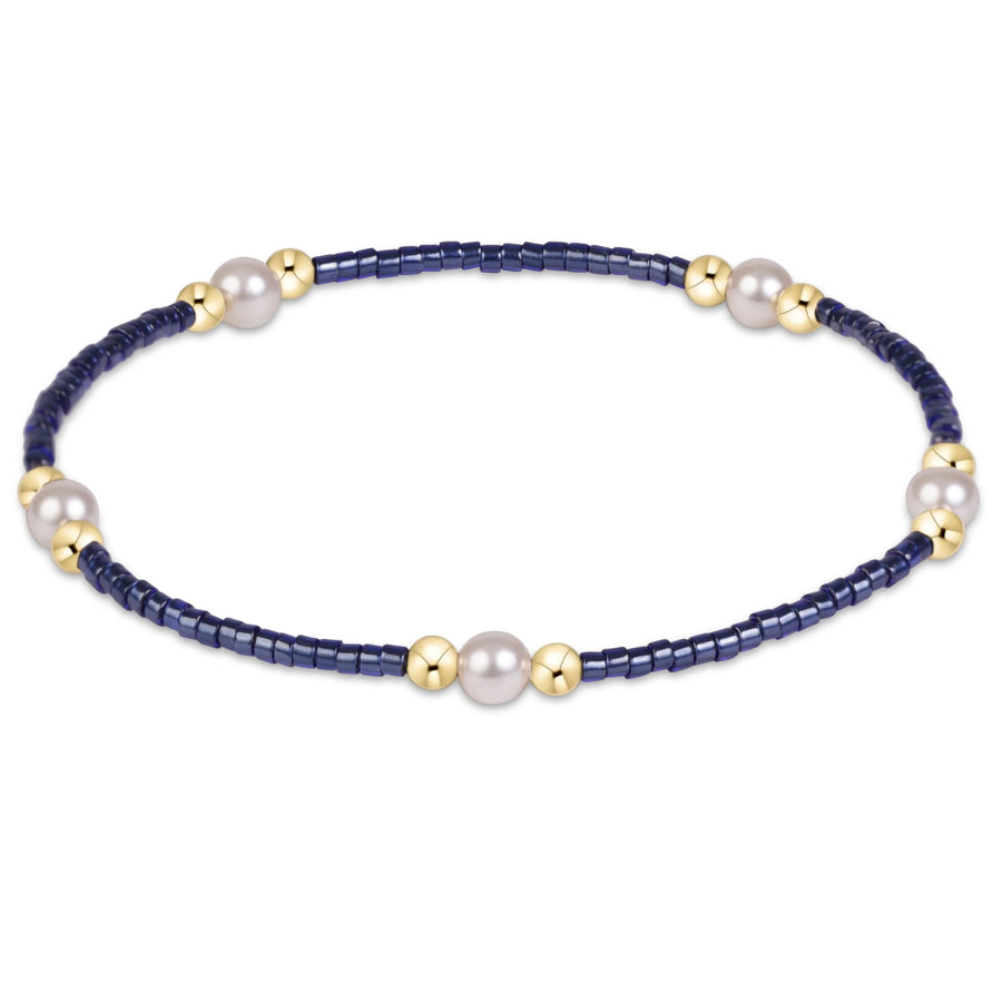 eNewton Hope Purpose Pearl Bracelet in Navy with deep blue seed beads, white crystal pearls, and polished 14kt gold-filled accent beads