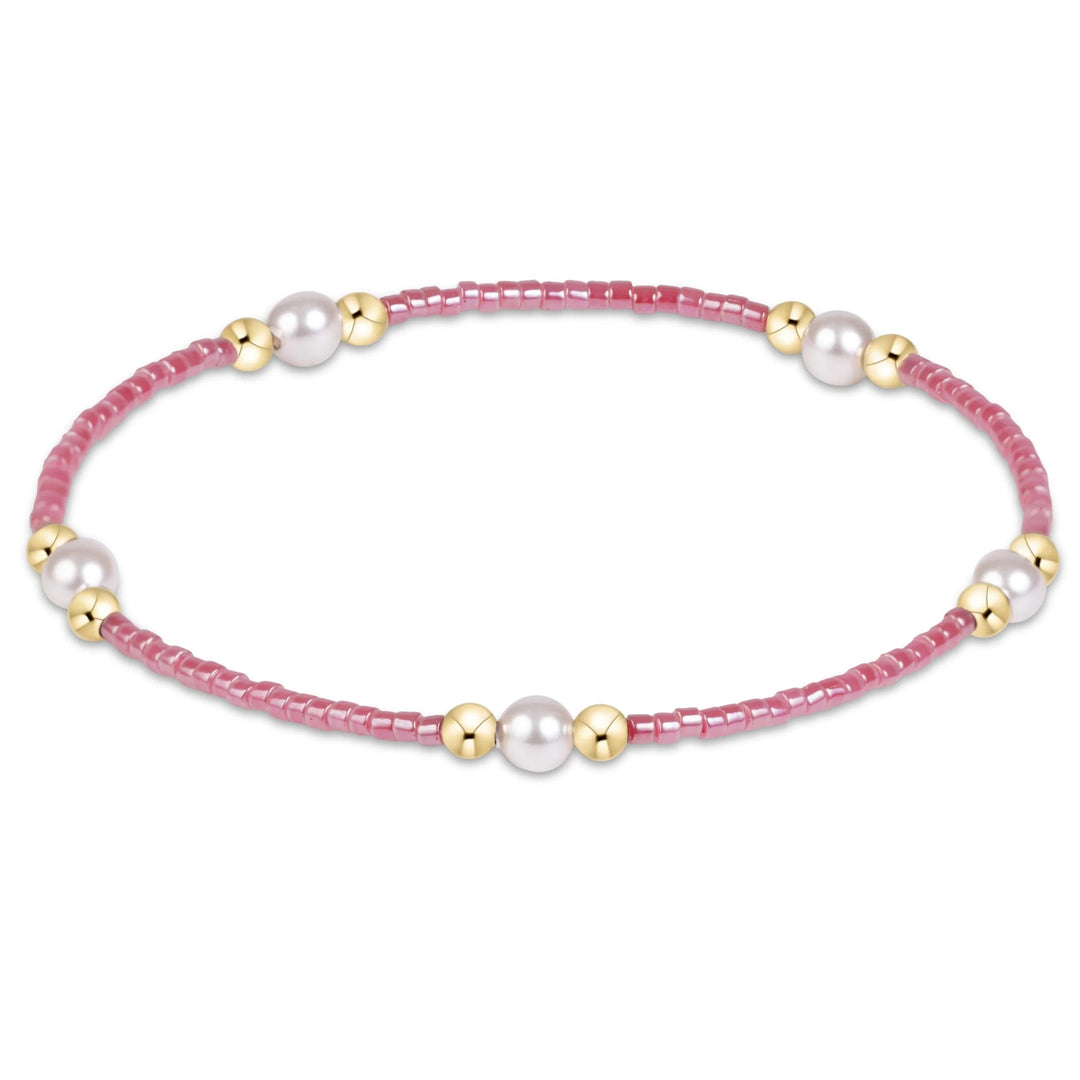 eNewton Hope Purpose Pearl Bracelet in Pink Champagne with rosy-pink seed beads, five white crystal pearls, and 14kt gold-filled bead accents.