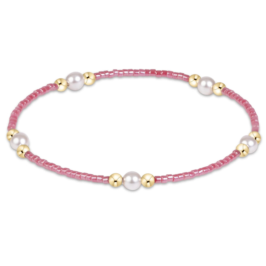 eNewton Hope Purpose Pearl Bracelet in Pink Champagne with rosy-pink seed beads, five white crystal pearls, and 14kt gold-filled bead accents.