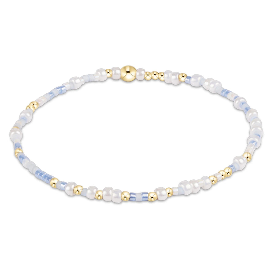 blue and neutral beaded hope unwritten bracelet with gold accents by enewton