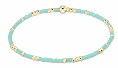 Mint-green and gold beaded bracelet with 14kt gold accents on elastic band