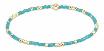 Turquoise and gold beaded bracelet with 14kt gold accents on elastic band