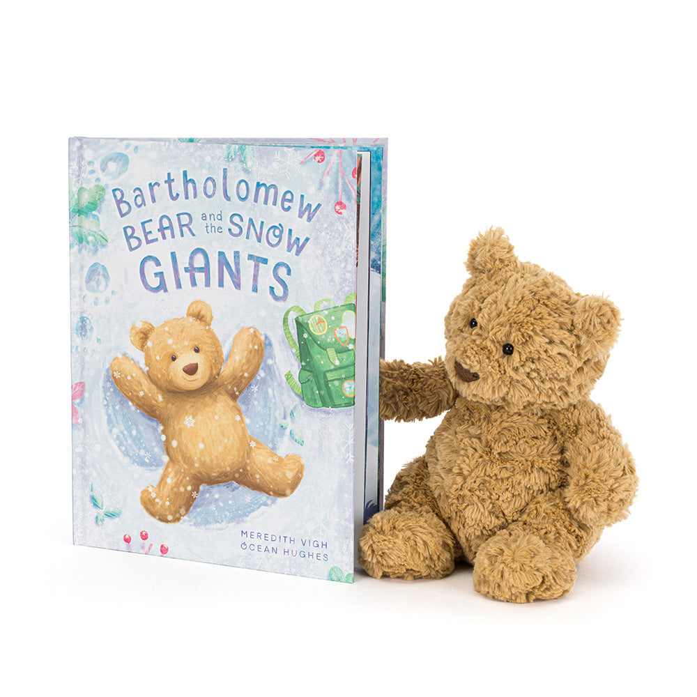 Bartholomew Bear plush sitting beside the book “Bartholomew Bear and the Snow Giants”