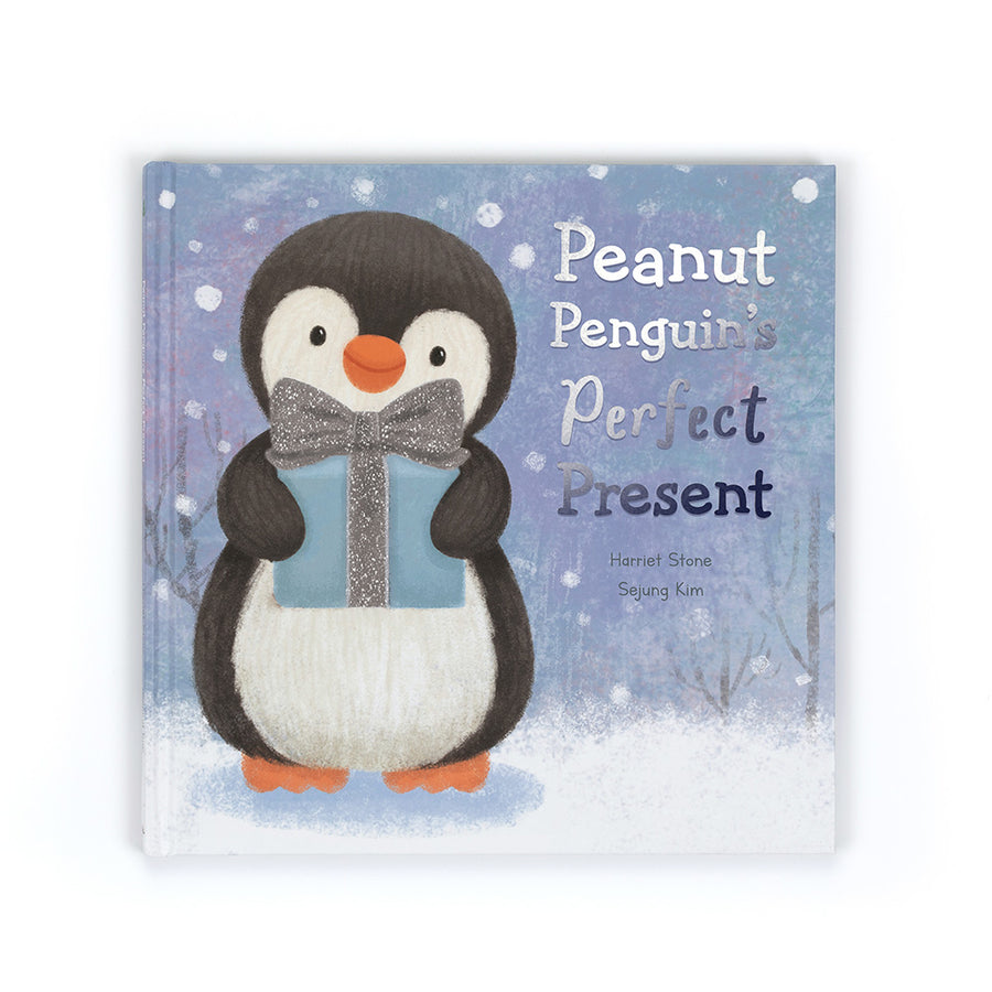 Peanut Penguin’s Perfect Present children’s book featuring a penguin holding a gift on a snowy background