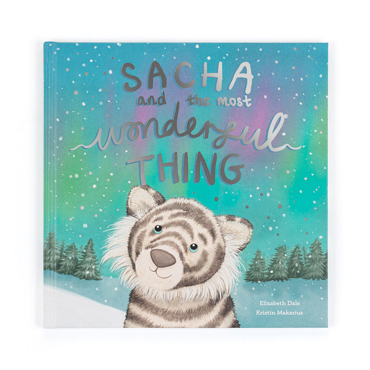 Sacha and the Most Wonderful Thing children’s book featuring Sacha Snow Tiger under a snowy sky