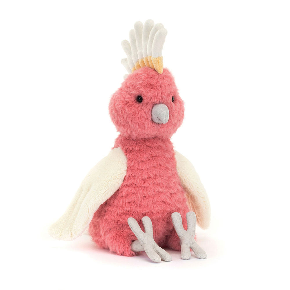 With feathers like a sunset and a flair for fruity concoctions, Squawkatoo is legendary for her beach party café!  
With a bright coral body, cream colored wings and her crown of cream and pale yellow feathers she is sure to turn heads. 