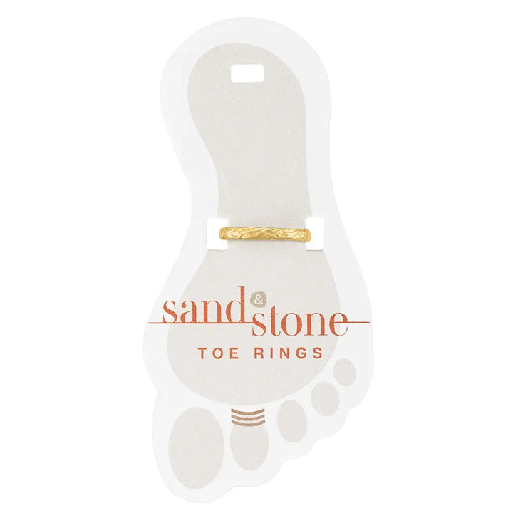 Gold hammered toe ring on display card
