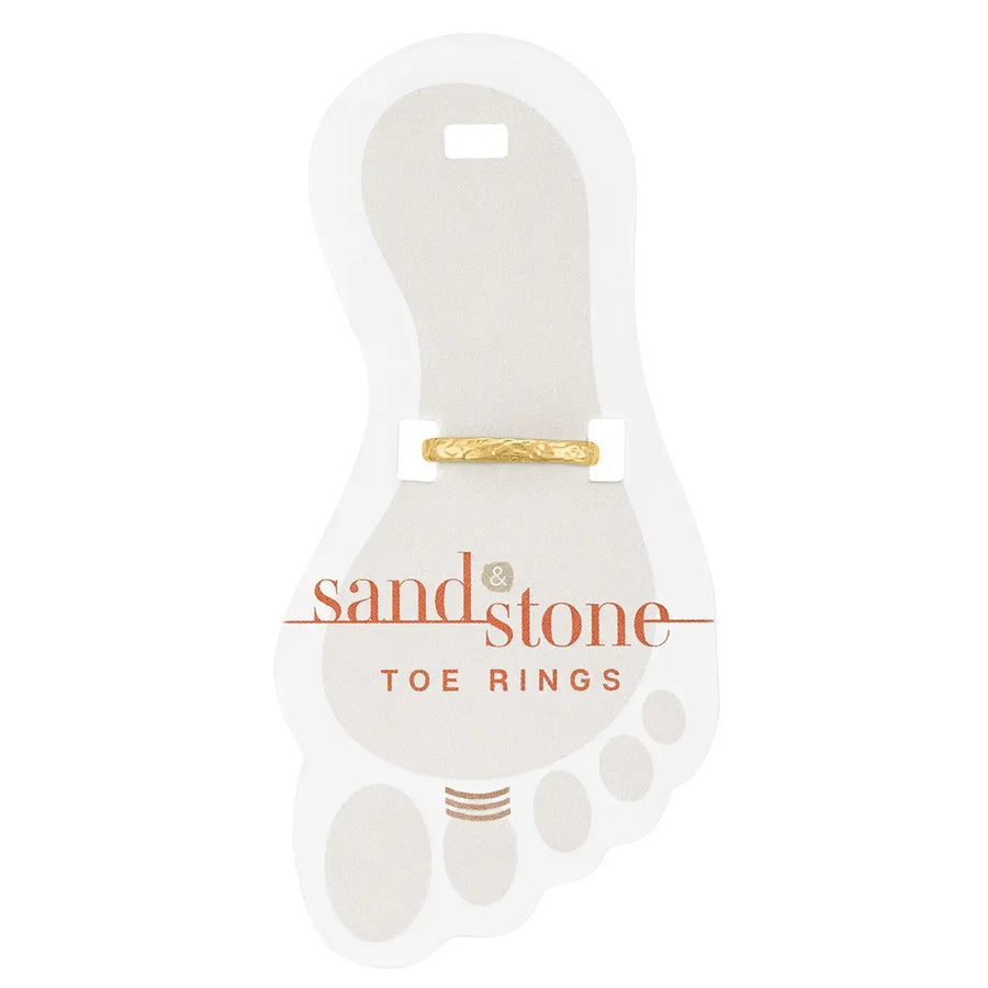 Gold hammered toe ring on display card
