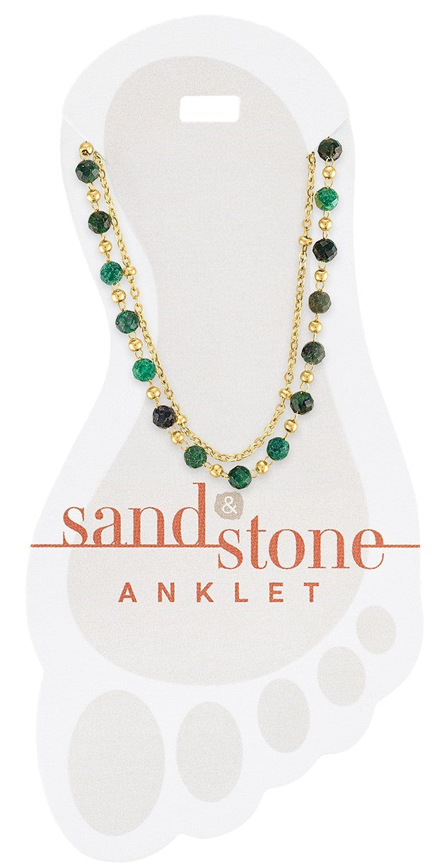 gold double strand anklet with green beaded accents shown on display card