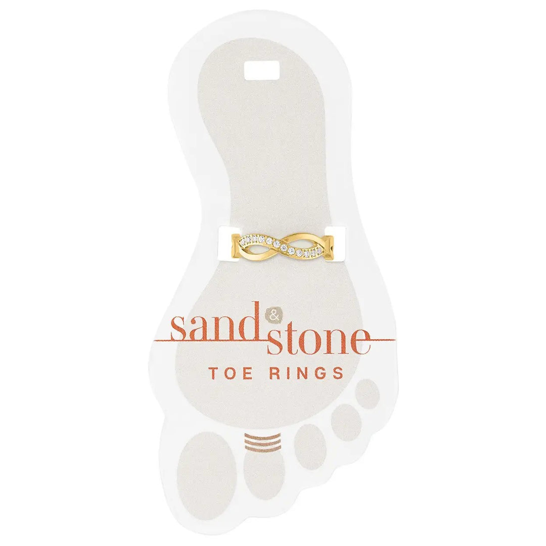Gold infinity toe ring with cubic zirconia stones on display card