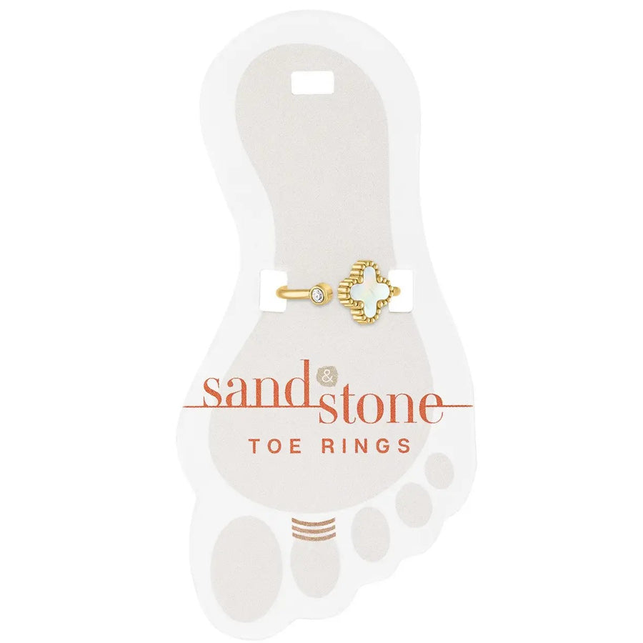 Gold toe ring with mini cubic zirconia and quatrefoil design on display card
