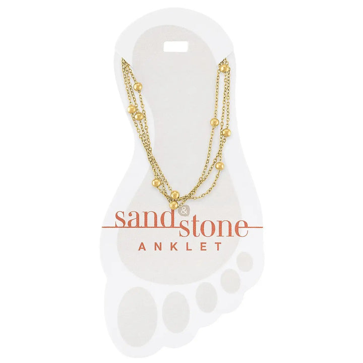 gold stainless steel multi strand anklet with layered chains and bead accents shown on display card