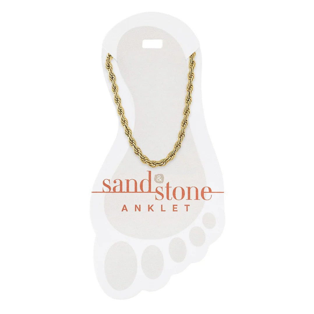 Gold chain anklet on a 'sand & stone' branded card with a white background
