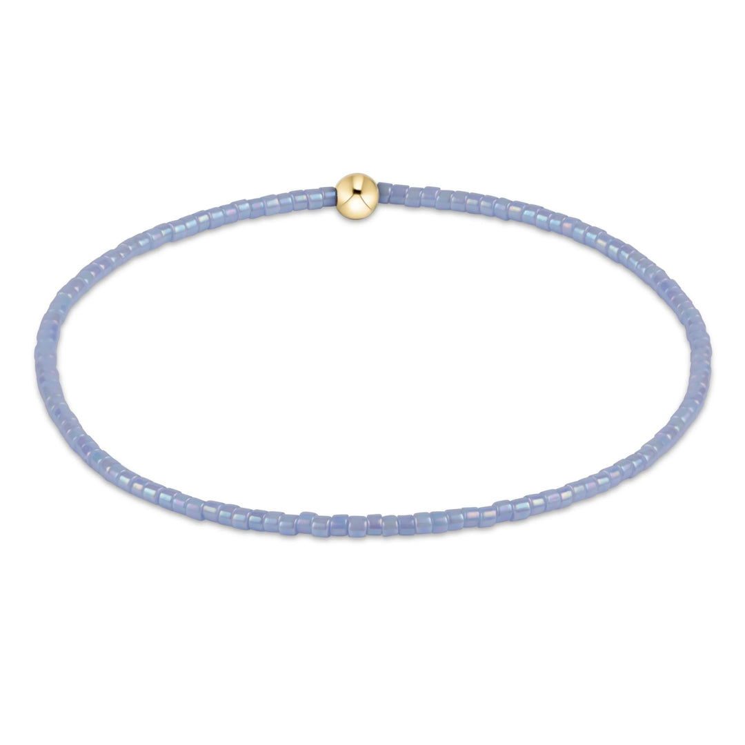 e newton Extends Hope Classic Bracelet in Ocean Mist featuring soft blue seed beads with a single 14kt gold-filled accent bead on a stretch elastic design.