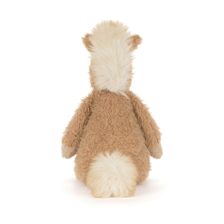 Soft plush pony with tan fur, cream accents, and fluffy mane sitting upright facing backwards