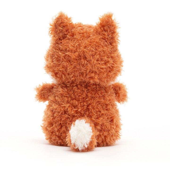 Jellycat Little Fox plush with curly orange fur, white tipped tail sitting backwards on a white background.