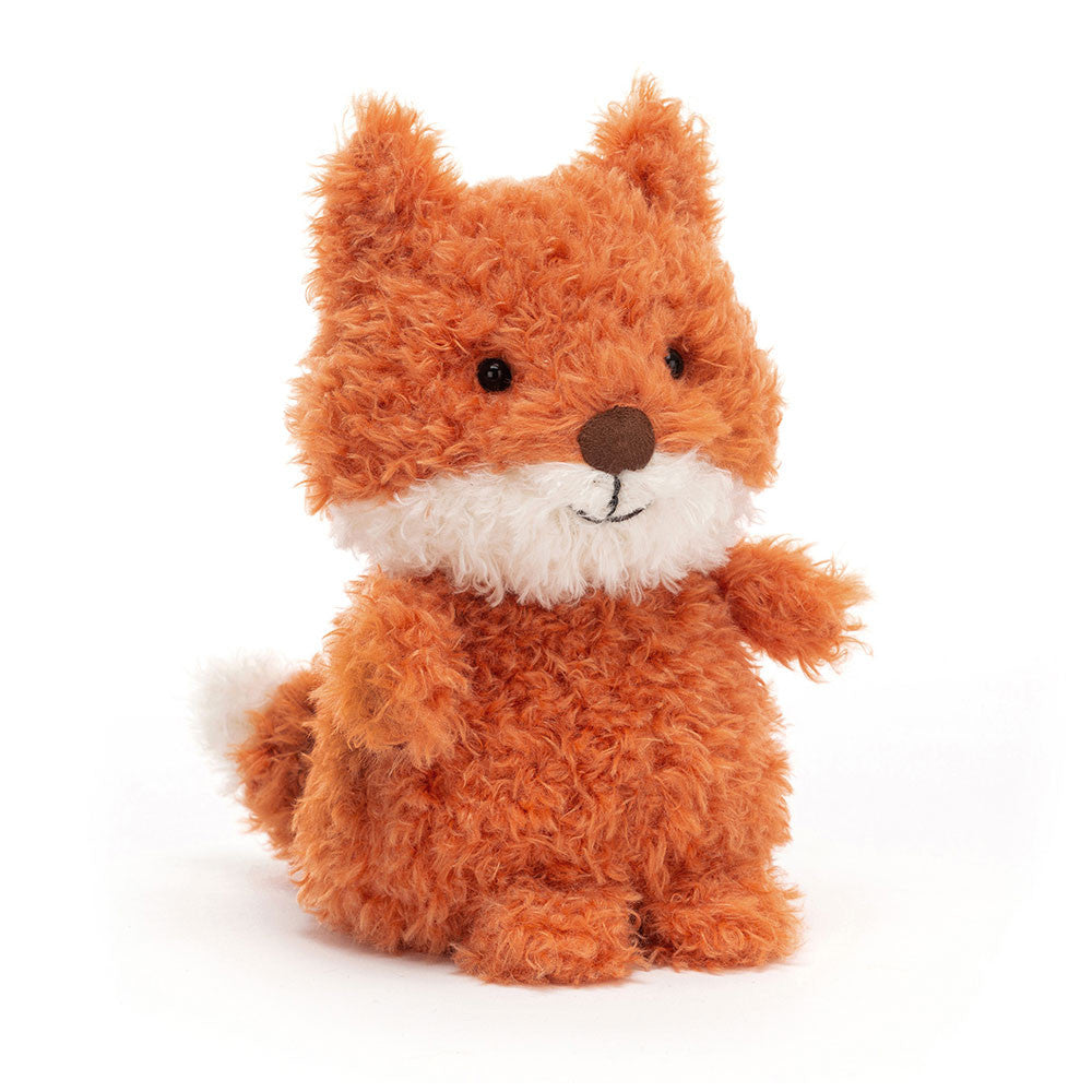Jellycat Little Fox plush with curly orange fur, white muzzle and tail tip, brown nose, and a sweet embroidered smile sitting on a white background.