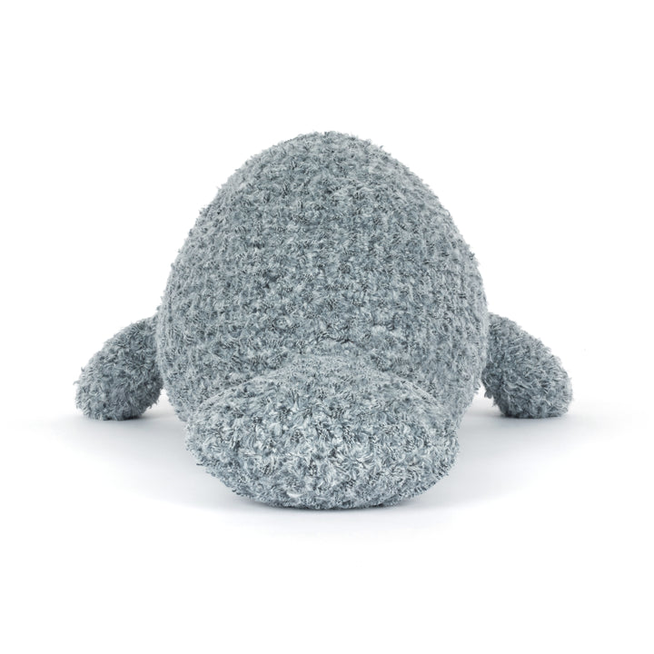 Plush toy manatee with textured surface on a white background back view