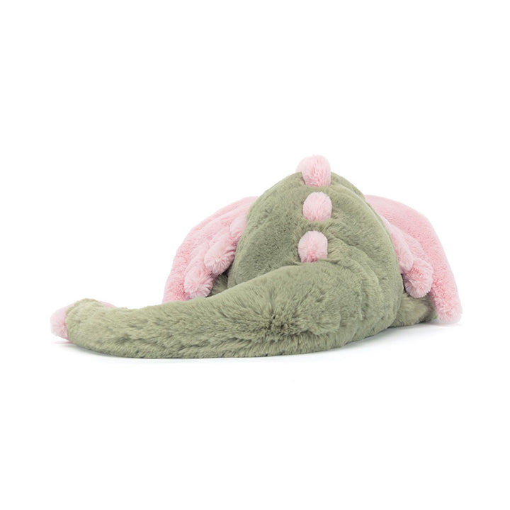 Jellycat Malachy Dragon plush with soft green fur, pink wings, rear pose showing tail wings, and scales. 
on a white background. 
