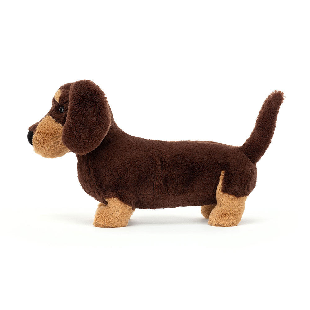Plush dachshund toy on a white background