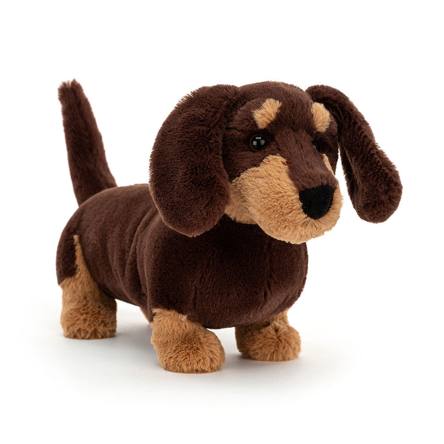 Plush brown dachshund Jellycat toy with floppy ears and tan accents.