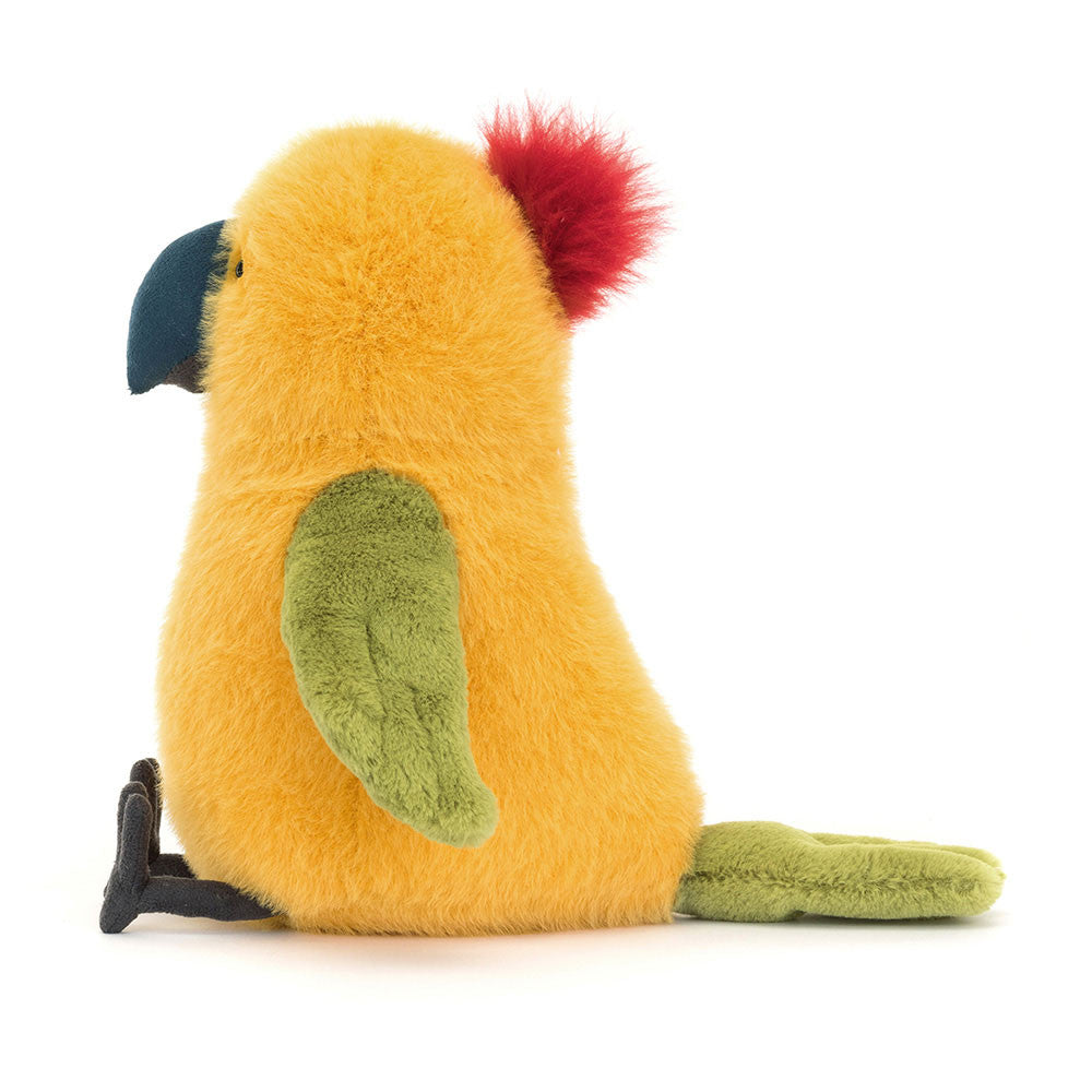 Budgeby Parrot side view shows off his dark beak and feet. This parrot has bright yellow "feathers" , green wings and tail and a fluffy tuft of red atop his head. 