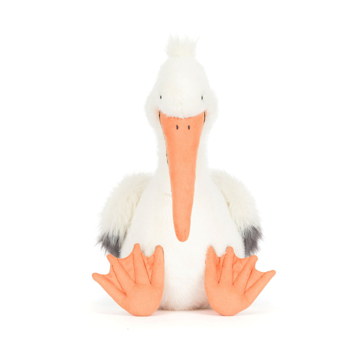 Stuffed pelican toy with a white body, orange beak, and feet on a white background