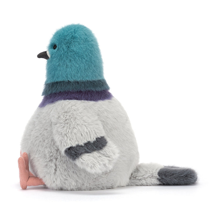 Strutton Pigeon plush with teal head, grey body, and peach feet sitting upright profile facing left