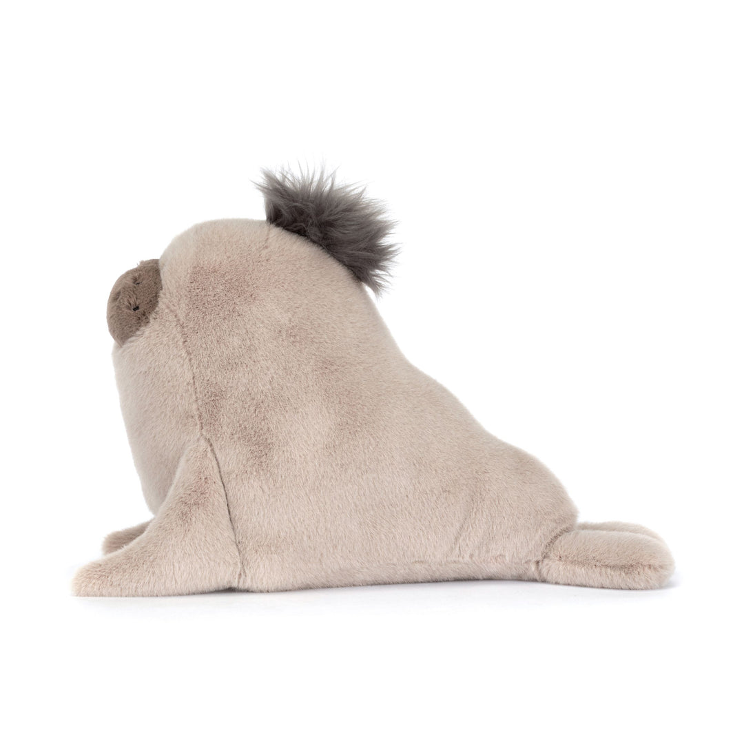 Plush sea lion with a fluffy tail on a white background