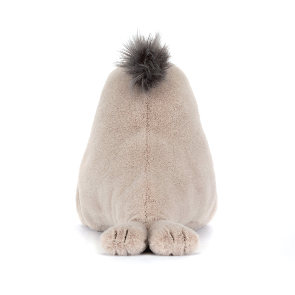 Plush toy sea lion with a fluffy top on a white background back view