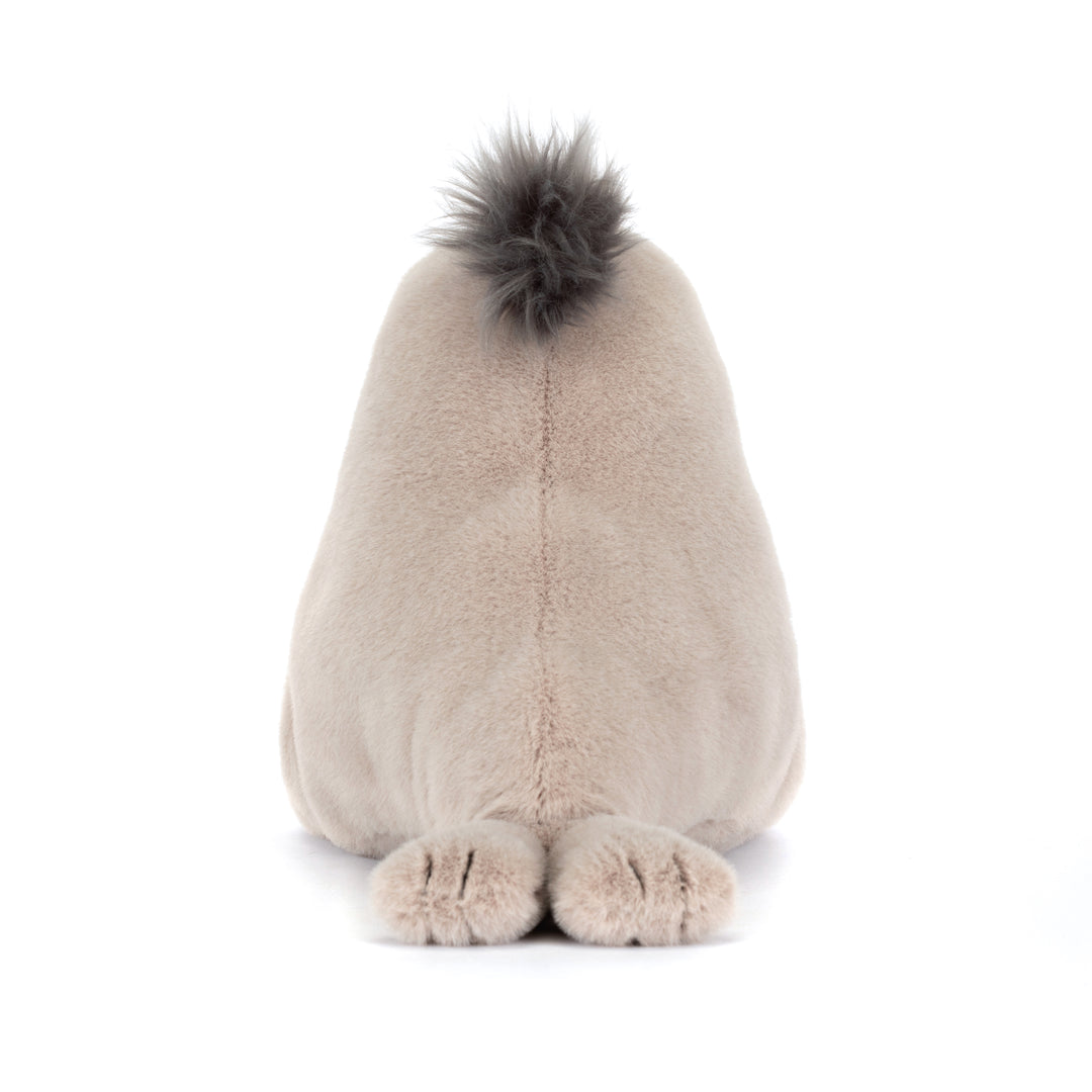 Plush toy sea lion with a fluffy top on a white background back view