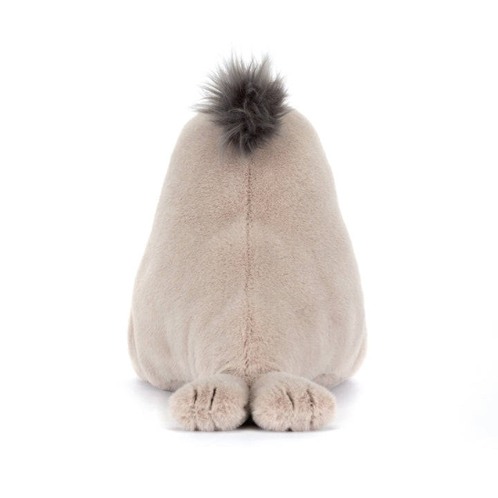 Plush toy sea lion with a fluffy top on a white background back view