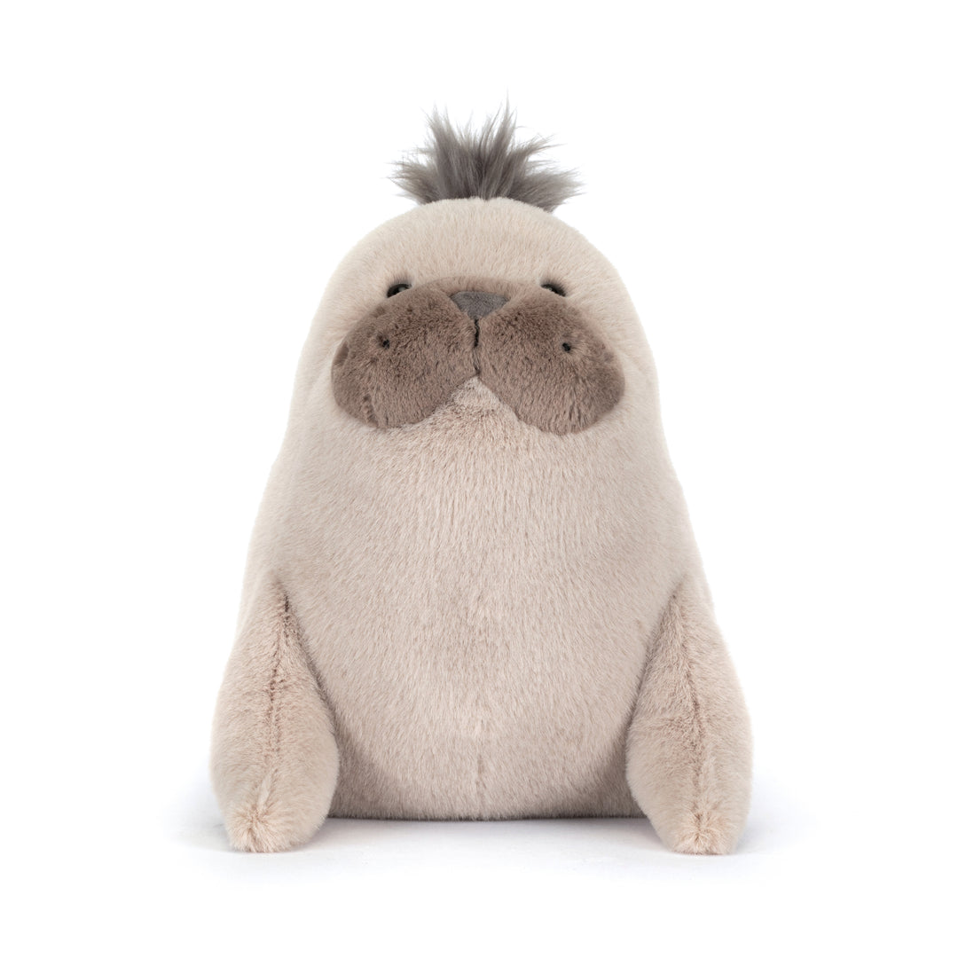 Plush toy sea lion with a fluffy top of the head on a white background