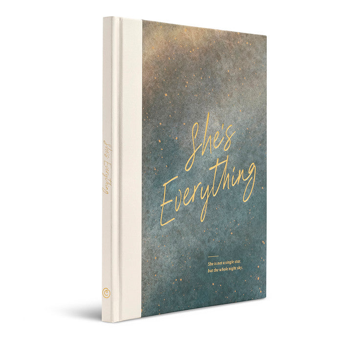Book with 'She's Everything' text on a textured cover