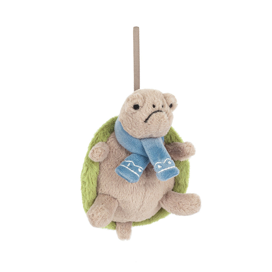 Plush turtle ornament wearing blue scarf and green shell hanging by a loop