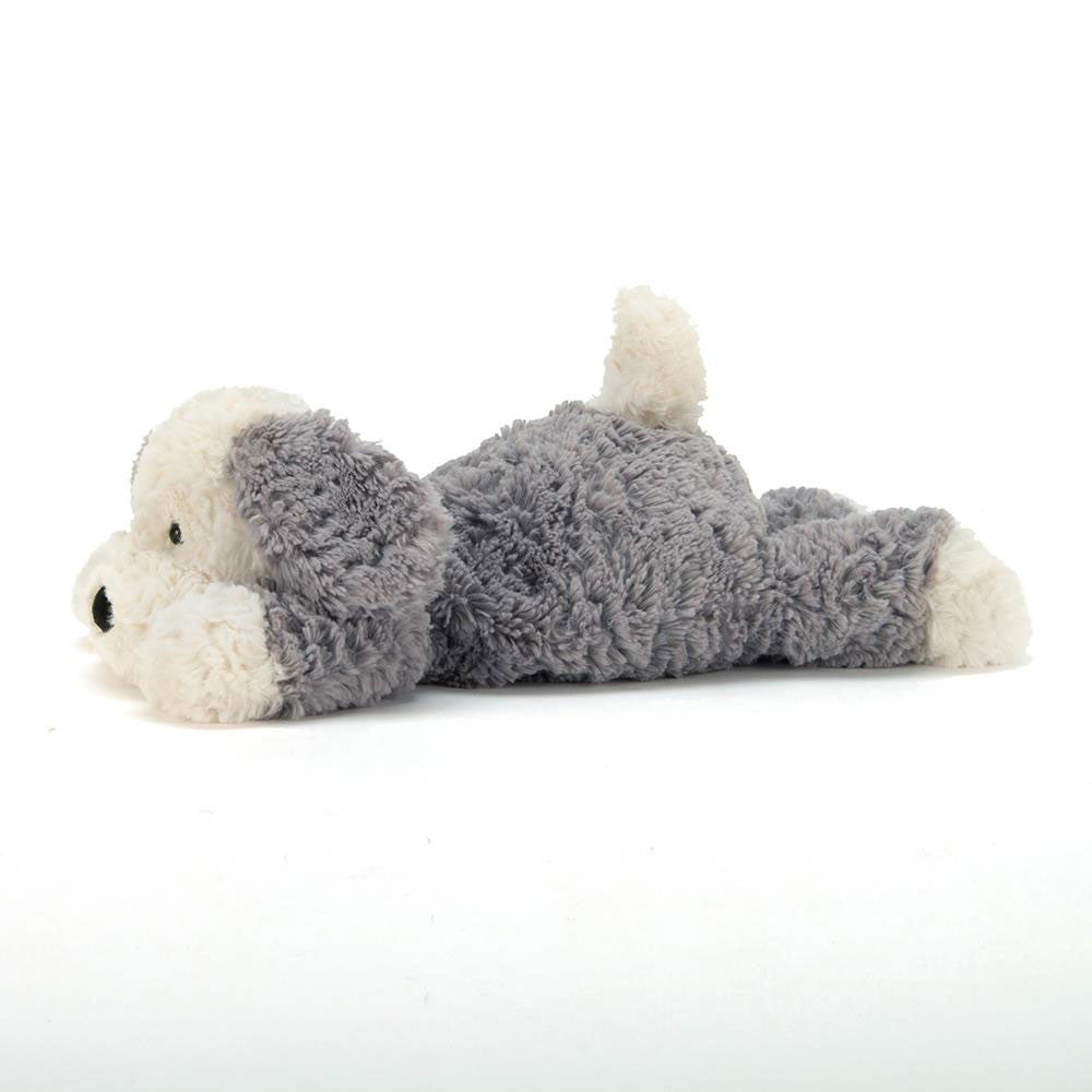 Tumblie Sheep Dog plush with cream and grey fur lying down on a white background