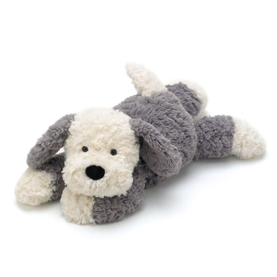 Tumblie Sheep Dog plush with cream and grey fur lying down on a white background