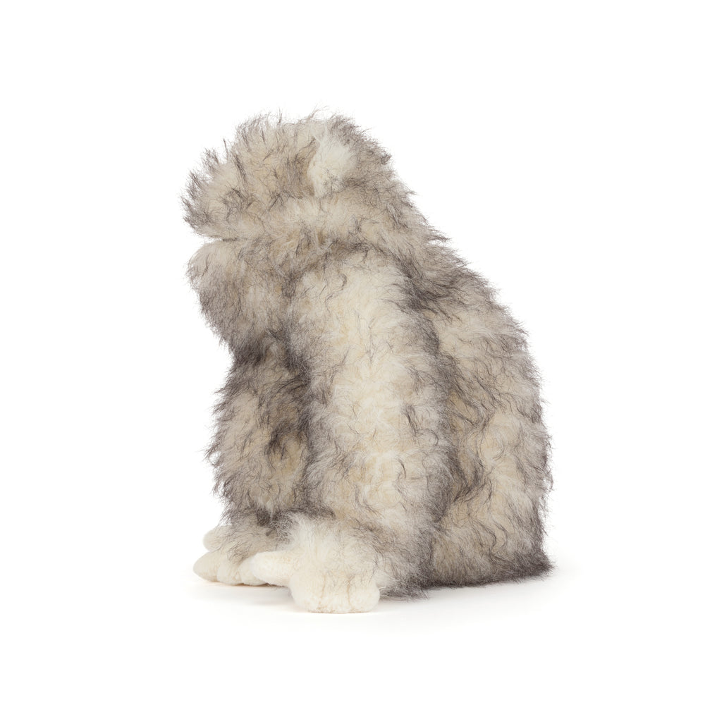 Bretti Yeti Jellycat plush with shaggy cream and gray fur, floppy arms, tiny feet, sitting on a white background.