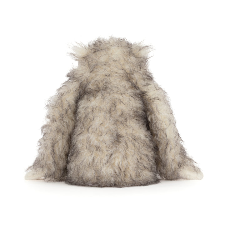 Bretti Yeti Jellycat plush with shaggy cream and gray fur &  floppy arms sitting on a white background.