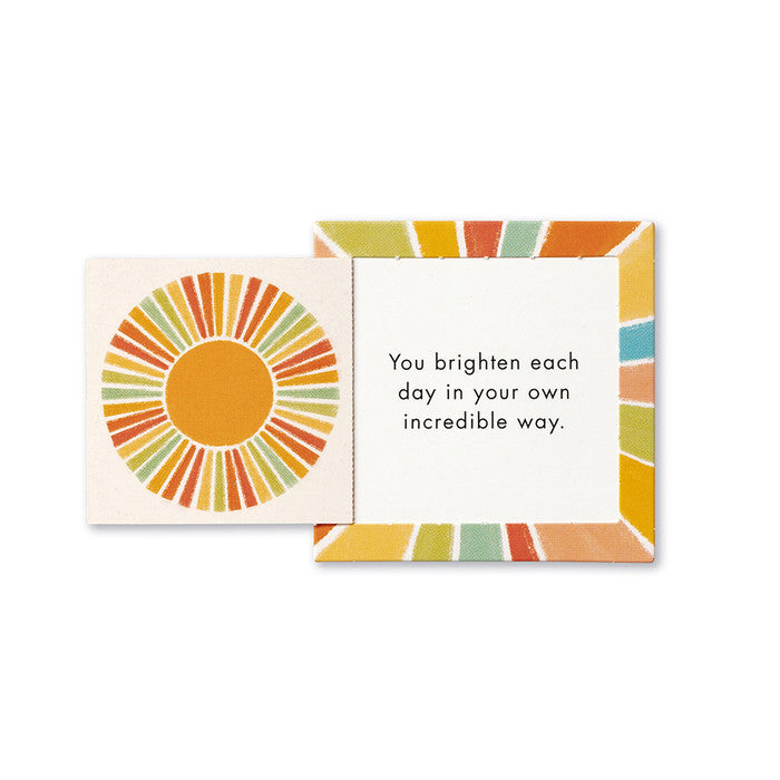 Colorful card with a sun design and text on a white background