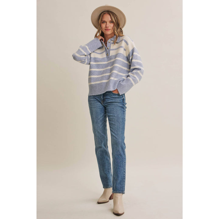 Woman wearing The Marlowe ice blue and ivory striped brushed Henley sweater with blue jeans
