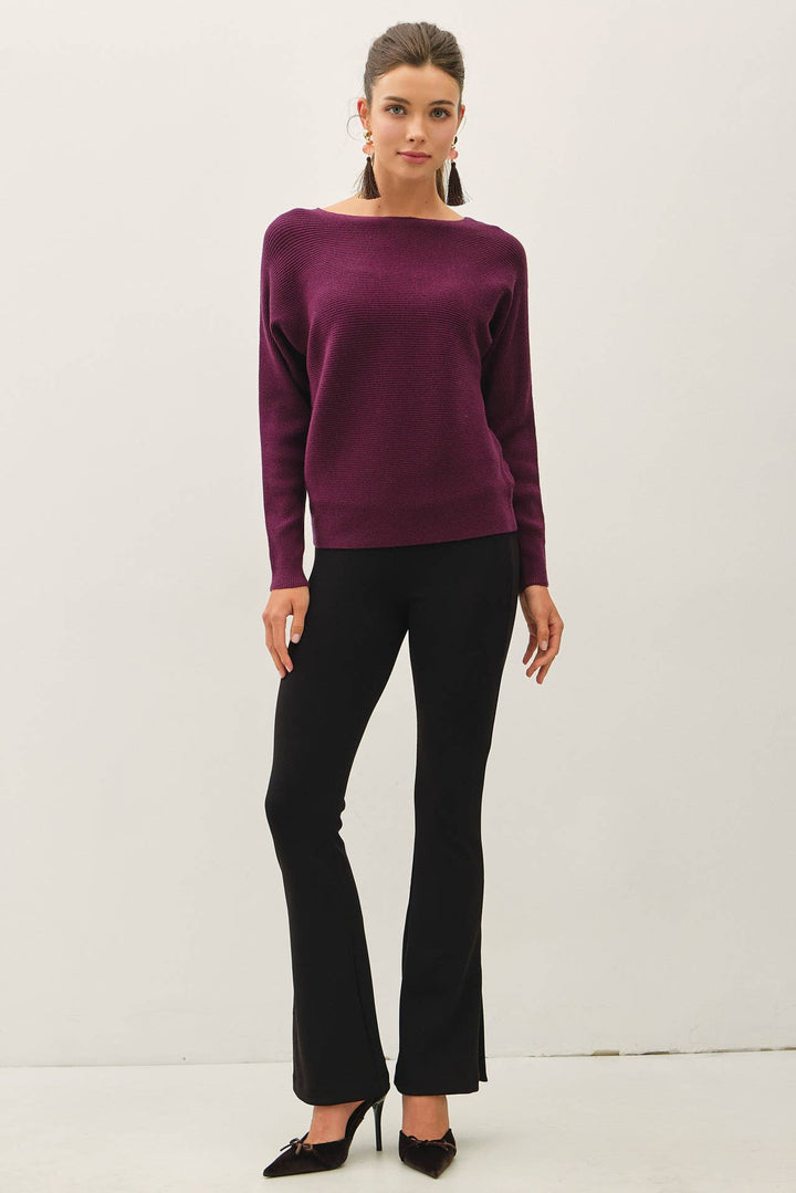 Be Cool The Shelby Sweater in deep plum purple featuring a ribbed knit, boat neckline, long dolman sleeves, and relaxed hip-length fit.